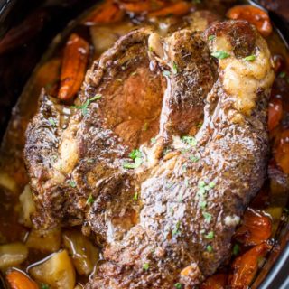 Ultimate Slow Cooker Pot Roast that leaves you with tender meat, vegetables and a built in gravy to enjoy them all with in just 15 minutes of prep! Perfect weeknight dinner!